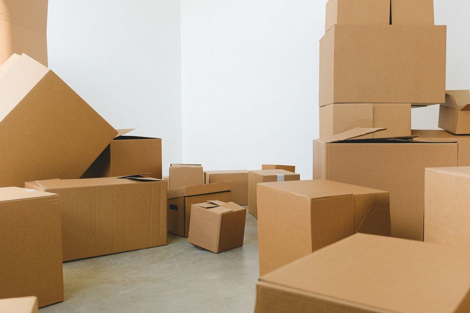 Packed moving boxes in an empty room